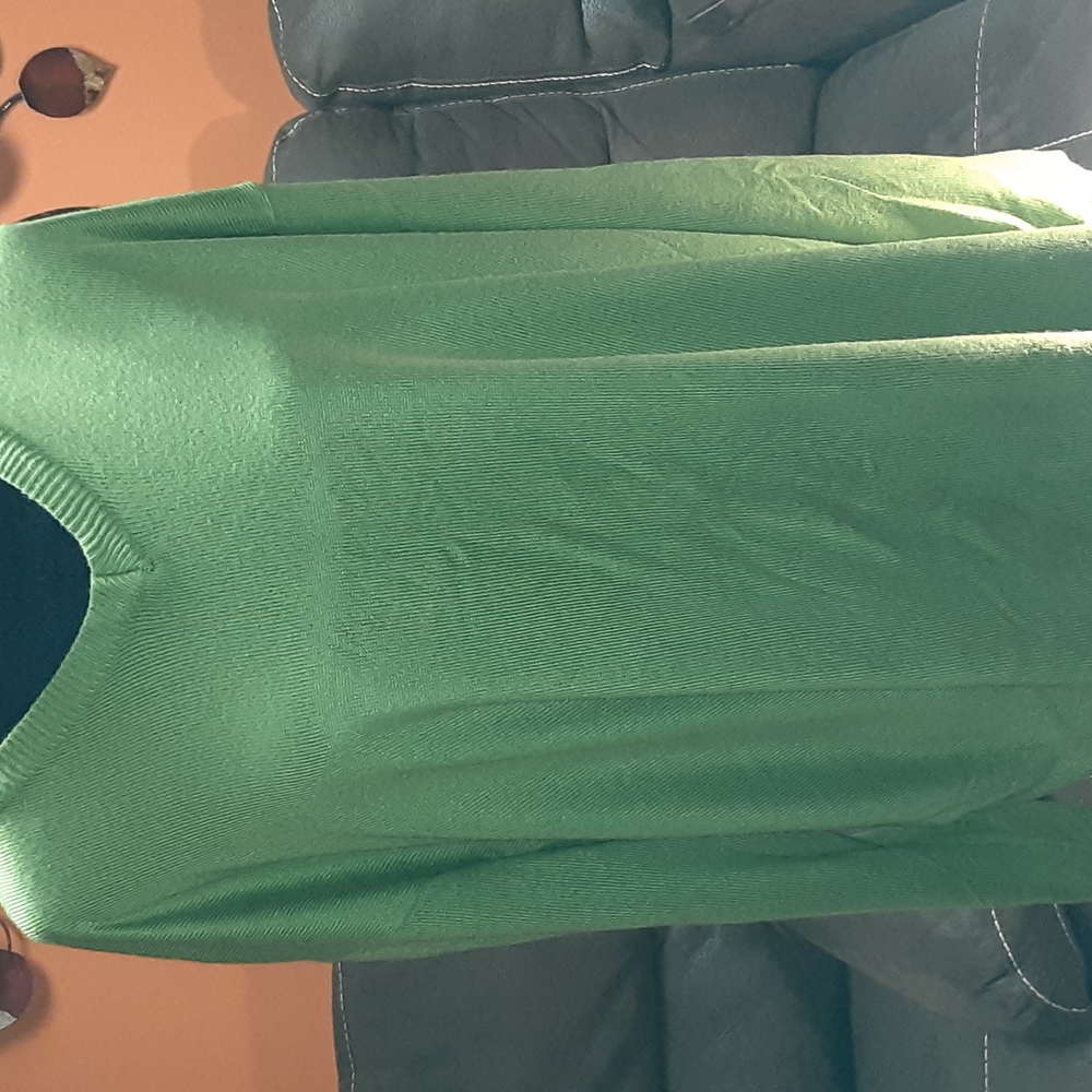 A light green sweater